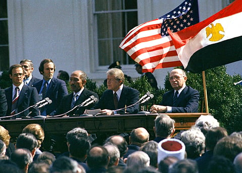 Former U.S. President Jimmy Carter, former Egyptian President Anwar Sadat and former Israeli President Menachem Begin attend the formal ceremony for the Camp David Accords in Washington, D.C., March 26, 1969, designed to bring peace to the Middle East.