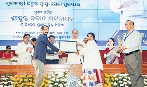 CM Naveen Patnaik presenting the award on Tuesday.