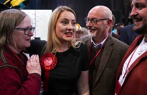 Labour Party candidate Gen Kitchen celebrates with her family after being declared winner in the Wellingborough by-election at the Kettering Leisure Village, Northamptonshire, Friday Feb. 16, 2024.