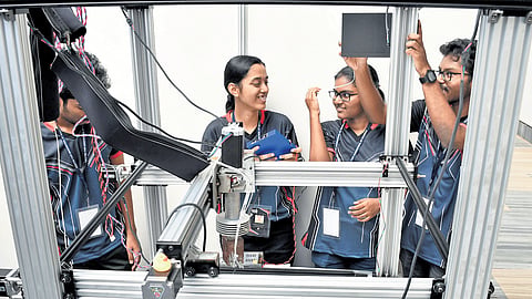 Students display a 3D metal printer developed by them, at the Open House 2024, IIT Madras Centre for Innovation, on Sunday