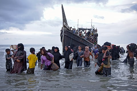 Ethnic Rohingya disembark from their boat upon landing on a beach in Ulee Madon, North Aceh, Indonesia, on Nov. 16, 2023.