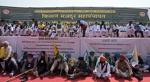 Members of various farmer unions gather at Ramlila Maidan for 'Kisan Mazdoor Mahapanchayat', in New Delhi on Thursday.