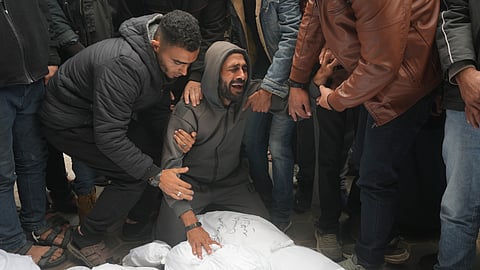 Palestinians mourn relatives killed in the Israeli bombardments of the Gaza Strip in front of the morgue of the Al Aqsa Hospital in Deir al Balah, Gaza Strip.