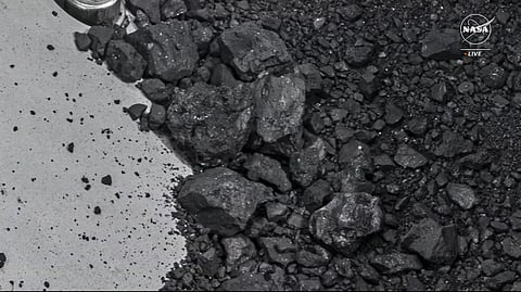 Image from a NASA TV broadcast from Houston, Texas, on October 11, 2023, shows the OSIRIS-REx sample collector with sample material from asteroid Bennu.