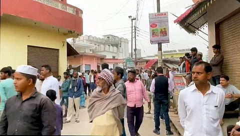 People gather outside the residence of the jailed gangster-turned-politician Mukhtar Ansari who died of cardiac arrest in the Banda hospital, at Mohammadabad, in Ghazipur, Friday, March 29, 2024.