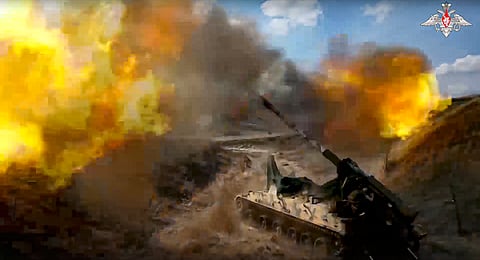 Russian 152 mm self-propelled gun fires toward Ukrainian position at an undisclosed location.