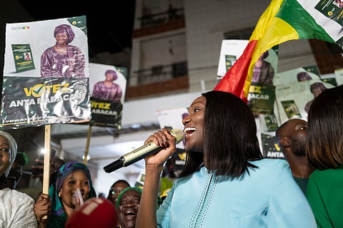 Presidential candidate Anta Babacar Ngom greets supporters during her electoral campaign caravan in Dakar, Senegal, Monday, March 11, 2024.