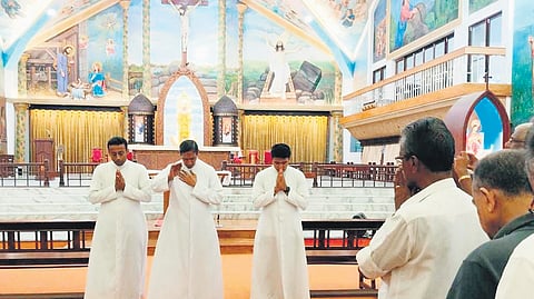 Priests offering prayers at St Mary’s Cathedral Basilica after its opening following a court order