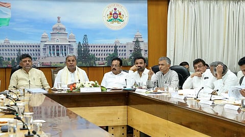 Chief Minister Siddaramaiah and DCM DK Shivakumar along with others in a video conference meeting with deputy commissioners, CEOs of ZPs and other officials.