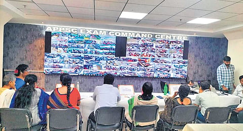 Officials monitoring the conduct of exams from the Command Control Centre in Vijayawada on Sunday I