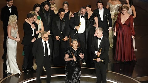 The cast and crew of "Oppenheimer" accept the award for best picture during the Oscars on Sunday, March 10, 2024, at the Dolby Theatre in Los Angeles.