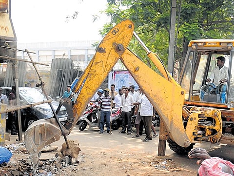 File photo of an encroachment being removed along a national highway.