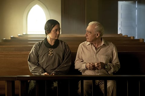 This image released by Apple TV+ shows Lily Gladstone, left, and director Martin Scorsese on the set of “Killers of the Flower Moon.”