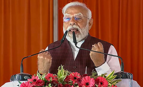 Prime Minister Narendra Modi speaks during the foundation stone laying and inauguration ceremony of various developmental projects, in Azamgarh, Sunday, March 10, 2024.