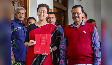 Delhi Finance Minister Atishi Singh with Chief Minister Arvind Kejriwal arrives at the Vidhan Sabha to present the State Budget 2024-25, in Delhi.