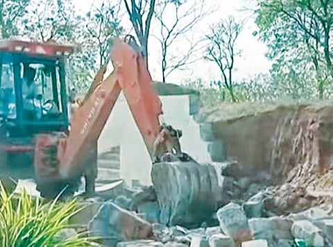 The road laid by Malla Reddy was demolished under the instructions of the Medchal-Malkajgiri district Collector Gautam.