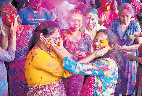 Bengalureans celebrate Holi with dry colours, owing to the city’s water crisis at
Shri Govardhan Nath Haveli on Monday