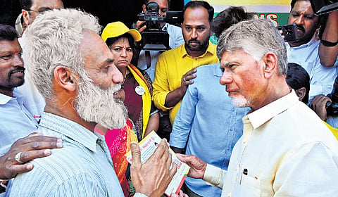 TDP supremo N Chandrababu Naidu takes part in a door-to-door campaign in his
home constituency Kuppam on Tuesday