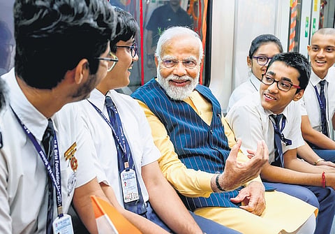 PM Narendra Modi takes a metro ride with students in Kolkata on Wednesday.