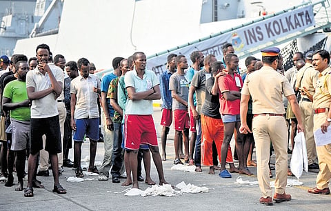 Pirates, apprehended by the Indian Navy in an operation off Somalia coast, being handed over to police after arrival in Mumbai on Saturday