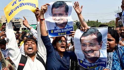AAP workers raise slogans during a protest against the arrest of Chief Minister Arvind Kejriwal by the Enforcement Directorate (ED) in the money laundering case linked to alleged irregularities in the scrapped Delhi excise policy 2021-22, in New Delhi, on March 22, 2024.