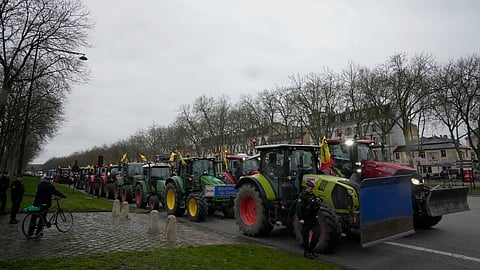 Tractors are parked during a protest, near the Chateau de Versailles, outside Paris, Friday, March 1, 2024.