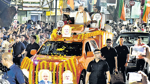 Prime Minister Narendra Modi during the road show, organised in support of BJP contestants for Lok Sabha election, in Pondi Bazaar in Chennai