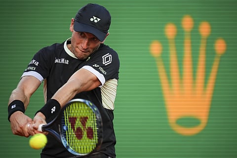 Casper Ruud of Norway, returns the ball to Serbia's Novak Djokovic during a semifinals match at the Monte Carlo Masters tournament in Monaco, Saturday, April 13, 2024.