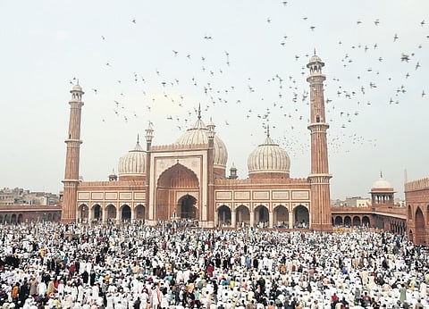 Devotees offer Namaz on the occasion of Eid-ul-Fitr at the Jama Masjid