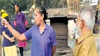 Women workers argue with BRS Peddapalli candidate Koppula Eshwar at Godavarikhani coal mine area on Wednesday