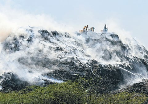 Smoke rises after a fire broke out at Bandhwadi landfill site in Gurugram