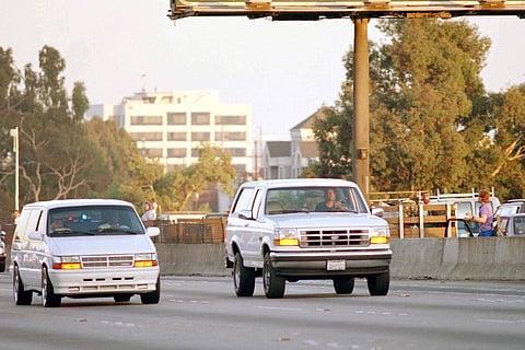 AI Cowlings, with O.J.Simpson hiding, drives a white Ford Bronco as they lead police on a two-county chase along the northbound 405 Freeway towards Simpson's home, June 17, 1994, in Los Angeles.