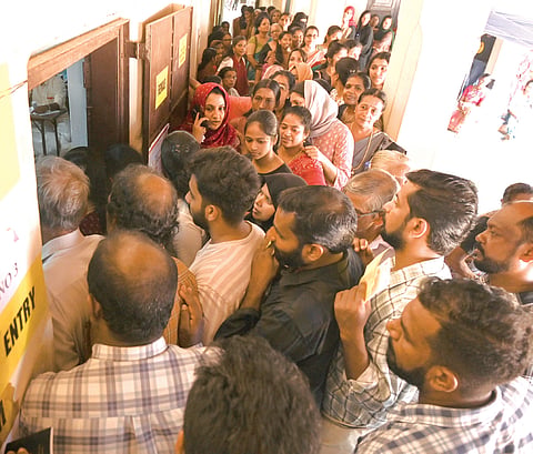 A long queue outside the polling booth at Kadathanad Raja Higher Secondary School, Kozhikode.