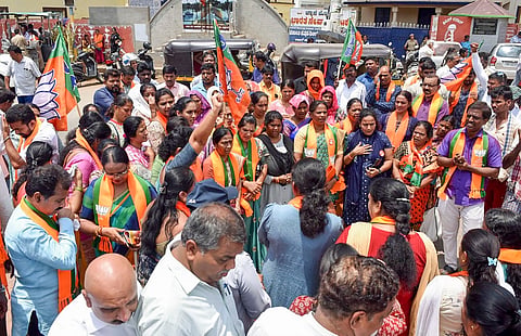 BJP supporters take part in a protest demanding justice for Neha Hiremath who was stabbed to death, in Chikmagalur, Karnataka, Monday, April 22, 2024.
