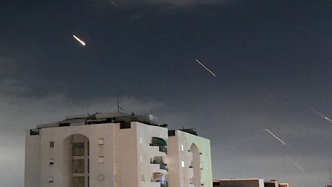 Israeli Iron Dome air defense system launches to intercept missiles fired from Iran, in central Israel.