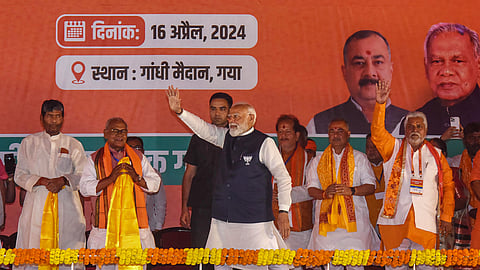 Prime Minister Narendra Modi waves at supporters during a public meeting ahead of Lok Sabha elections, in Gaya, Bihar.