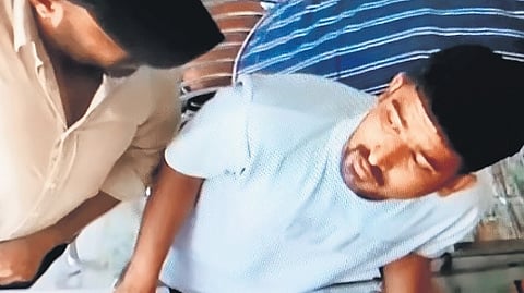 CCTV footage shows the robbers holding a gun at the pawnshop in Avadi