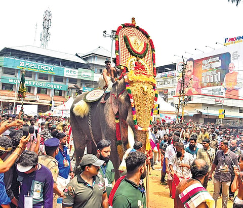 Tusker Thechikottukkavu Ramachandran carrying the idol of Neythalakkavu Bhagavathy arriving at Thekkinkad Maidan for Ghataka pooram.