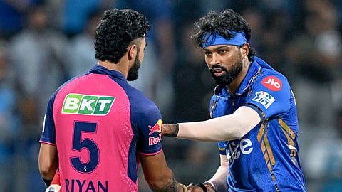 Mumbai Indians' captain Hardik Pandya greets Rajasthan Royals' Riyan Parag (L) at the end of the IPL Twenty20 cricket match between Mumbai Indians and Rajasthan Royals on April 1, 2024.