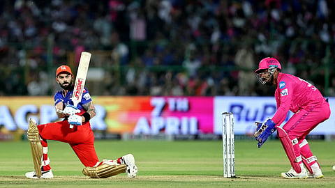 Royal Challengers Bengaluru's Virat Kohli plays a shot during the Indian Premier League (IPL) 2024 T20 cricket match between Rajasthan Royals and Royal Challengers Bengaluru at Sawai Mansingh Stadium, in Jaipur.