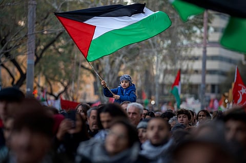 Six boys held for riding bikes with Palestinian flag