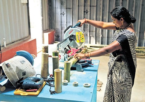 A tribal woman working at the processing unit in the Biodiversity Centre