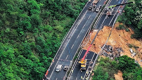 This aerial photo shows rescuers work at the site of a collapsed road section of the Meizhou-Dabu Expressway in Meizhou, south China's Guangdong Province, Wednesday, May 1, 2024.