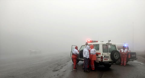 In this photo provided by Moj News Agency, rescue teams are seen near the site of the incident of the helicopter carrying Iranian President Ebrahim Raisi in Varzaghan in northwestern Iran, Sunday, May 19, 2024.