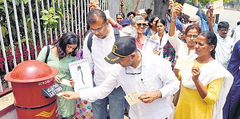 Members of civil society groups send postcards