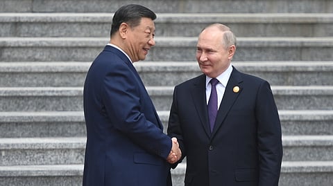 Chinese President Xi Jinping, left, and Russian President Vladimir Putin shake hands during their meeting in Beijing, China, on Thursday, May 16, 2024.