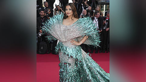 Aishwarya Rai Bachchan poses for photographers upon arrival at the premiere of the film 'Kinds of Kindness' at the 77th international film festival, Cannes, southern France, Friday, May 17, 2024.