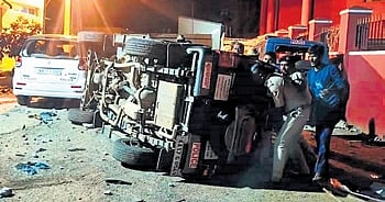 The police vehicle overturned by the mob in Channagiri on Friday night