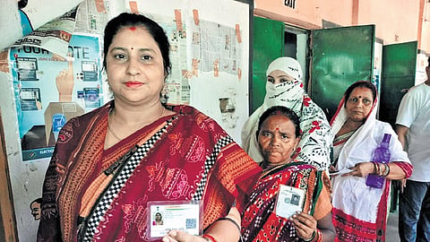 Vaishali, wife of Rohit Pujari, waits in queue to exercise her franchise