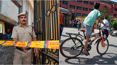 A police personnel exits the Mother Mary's School, Mayur Vihar after multiple schools received bomb threats via e-mail, in New Delhi.